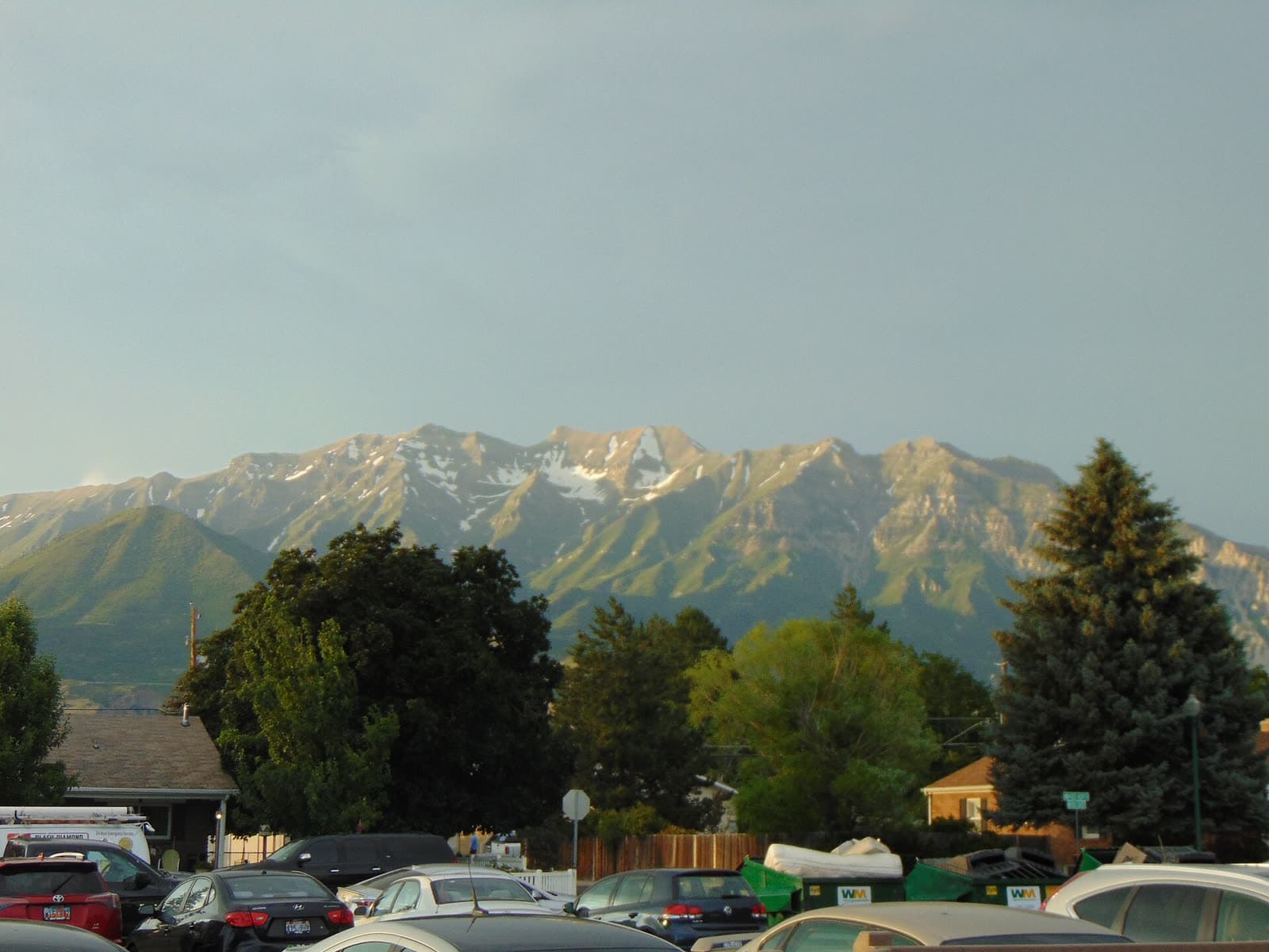 Snow-dusted Mount Timpanogos rising behind the rooftops of Orem, Utah
